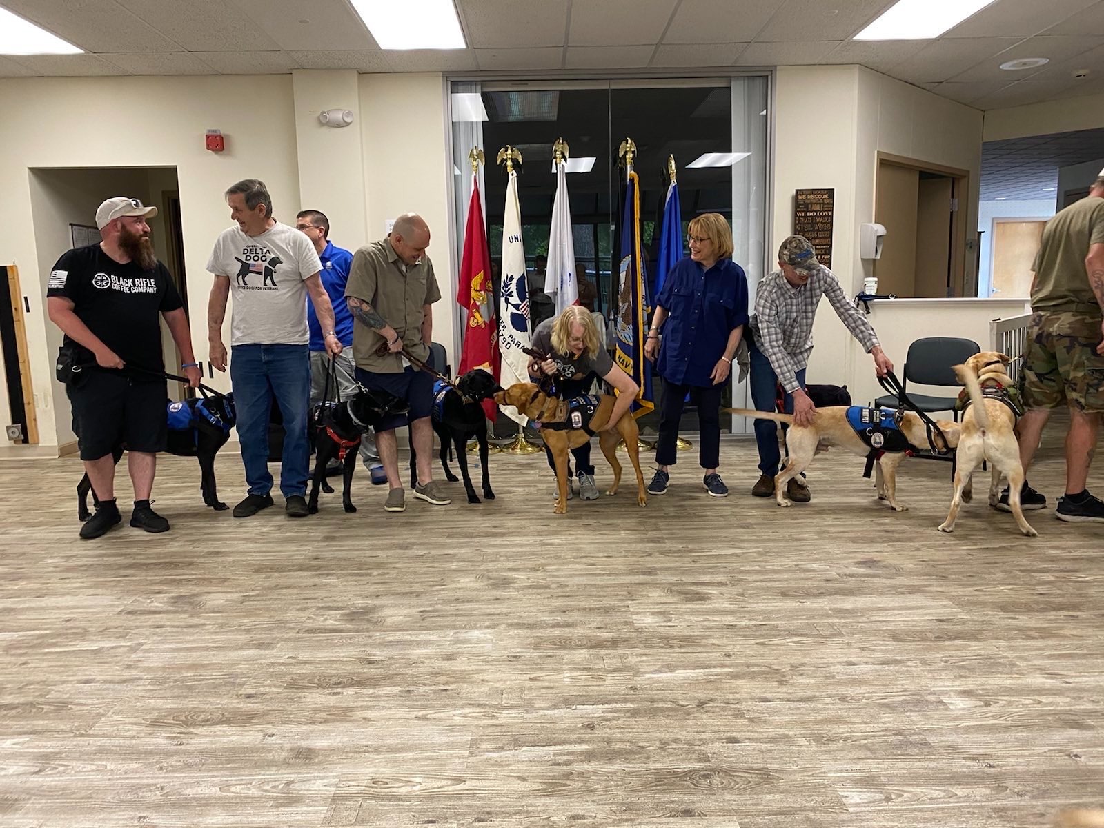 Senator Hassan pictured with Operation Delta Dog trainers, staff, and service dogs
